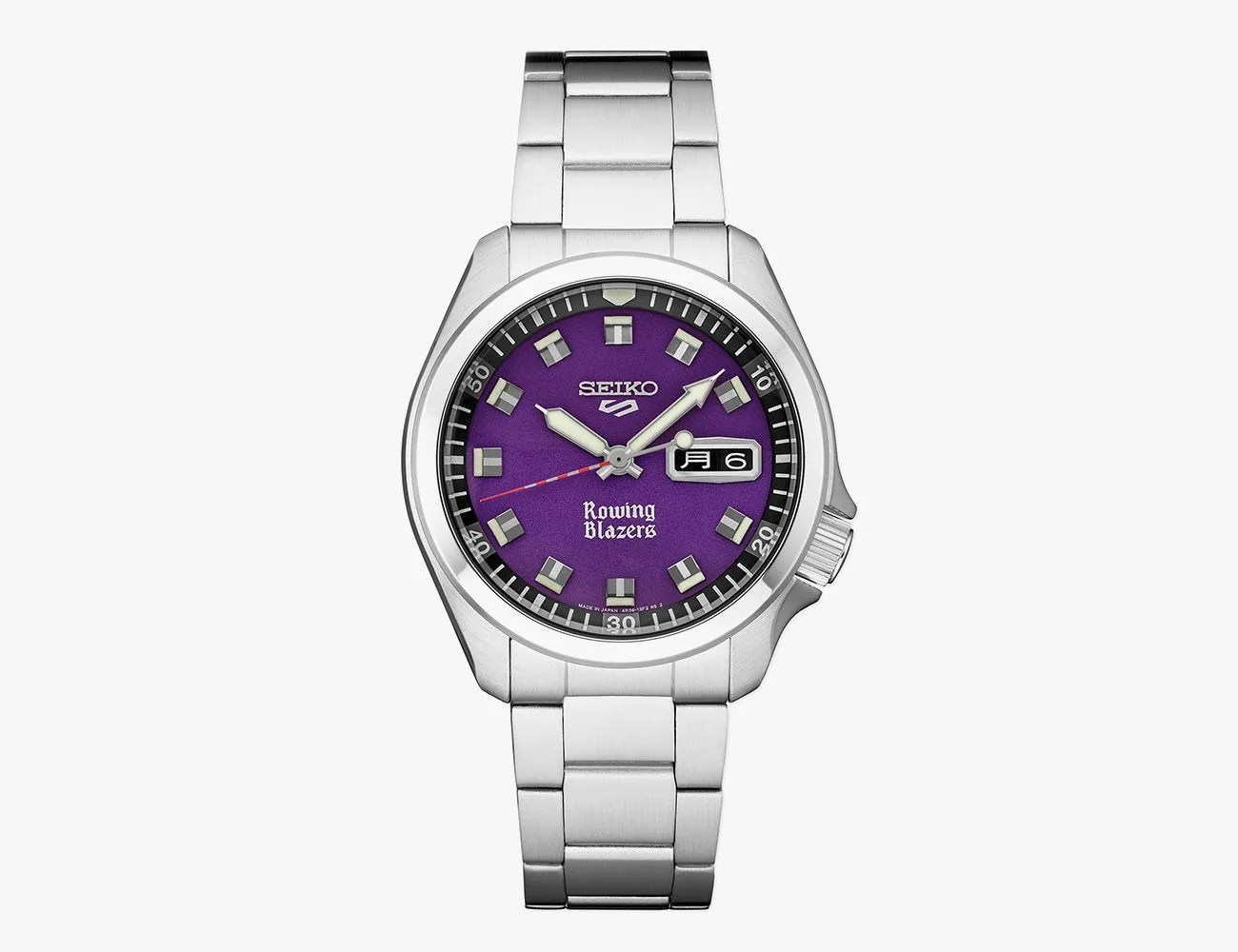 a silver watch with a purple face