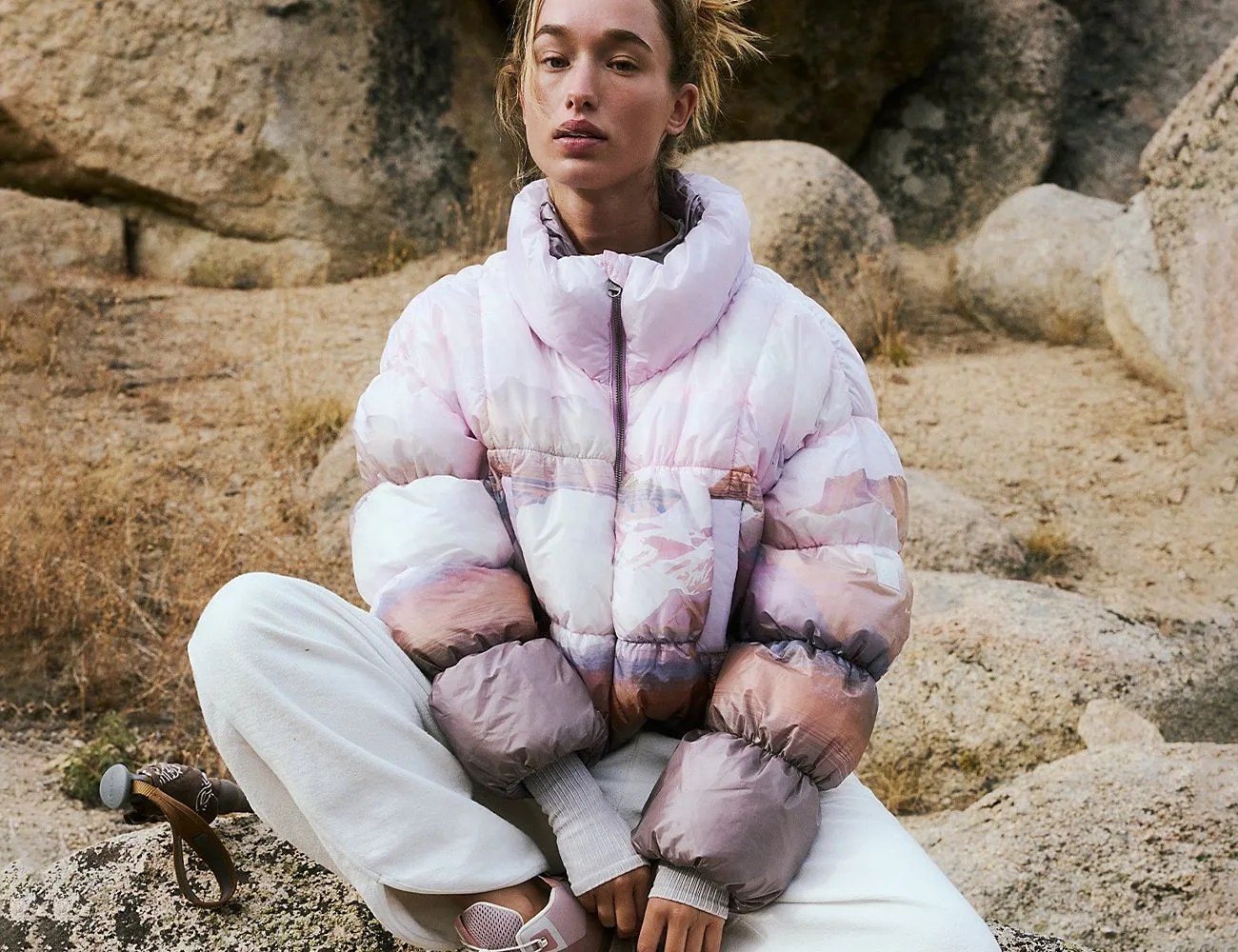 a woman wearing a puffer jacket outside