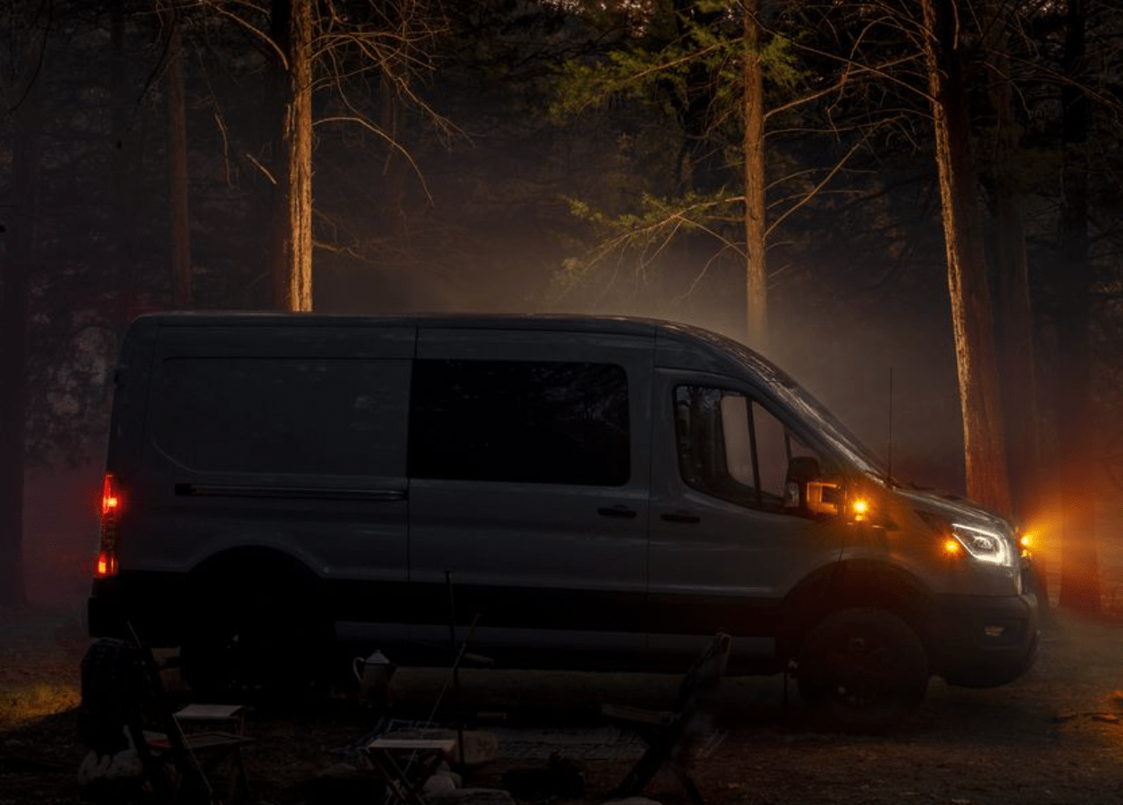 a van parked in a wooded area