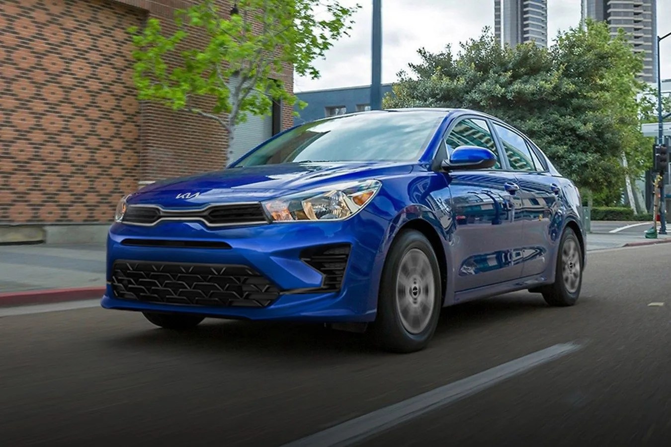 a blue car on a road