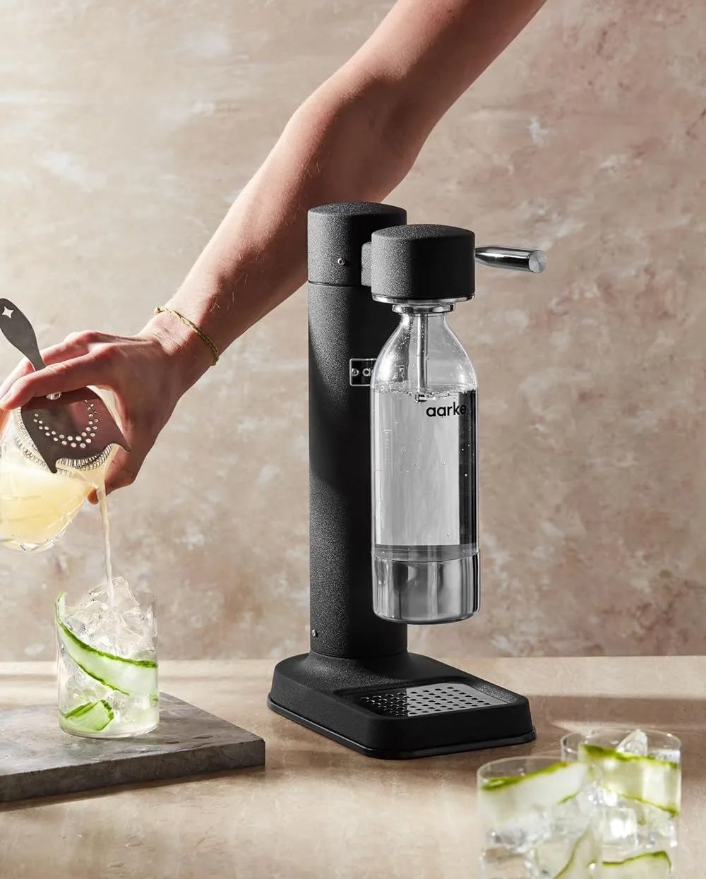 a person using a carbonator iii premium carbonator