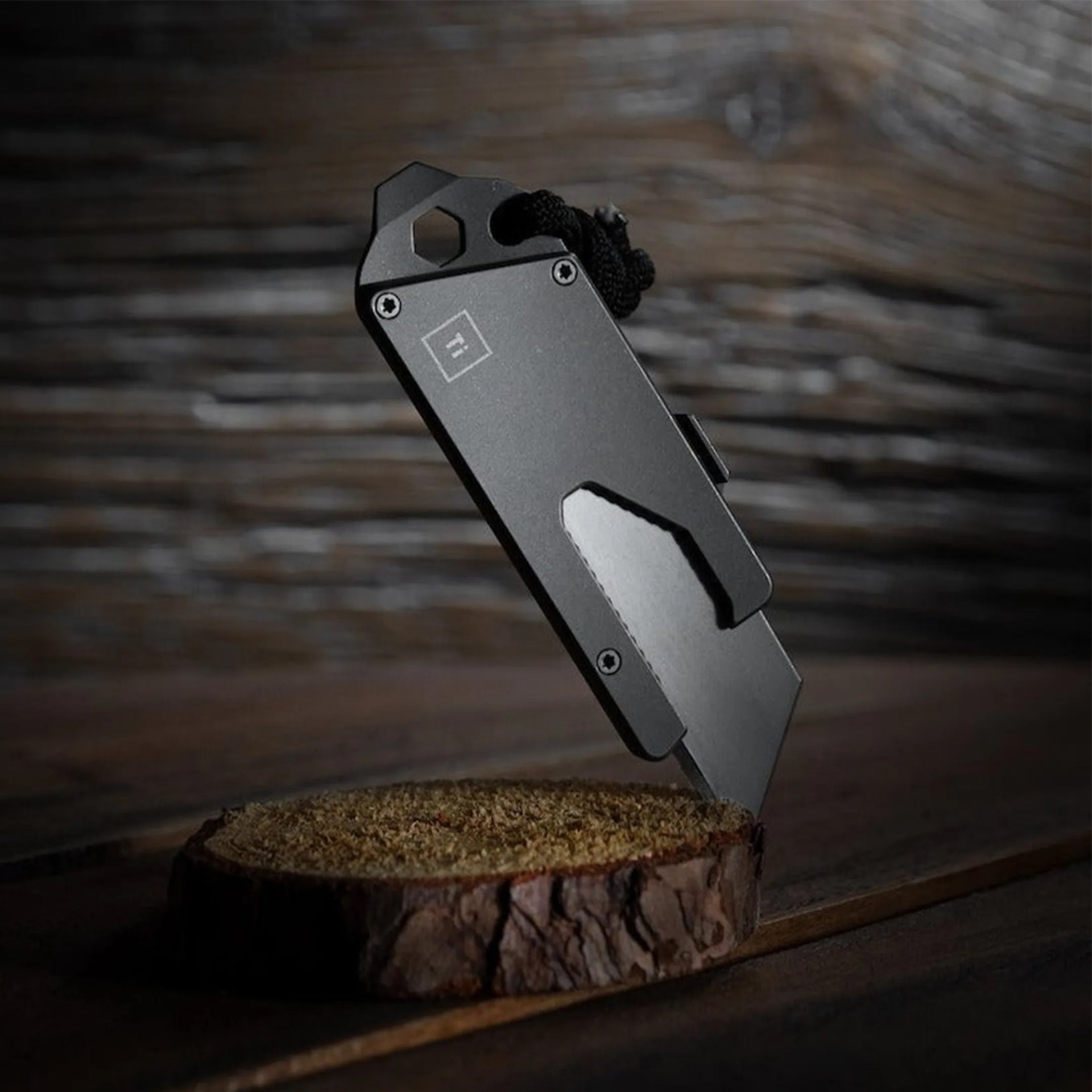 a big idea design knife stuck in a piece of wood