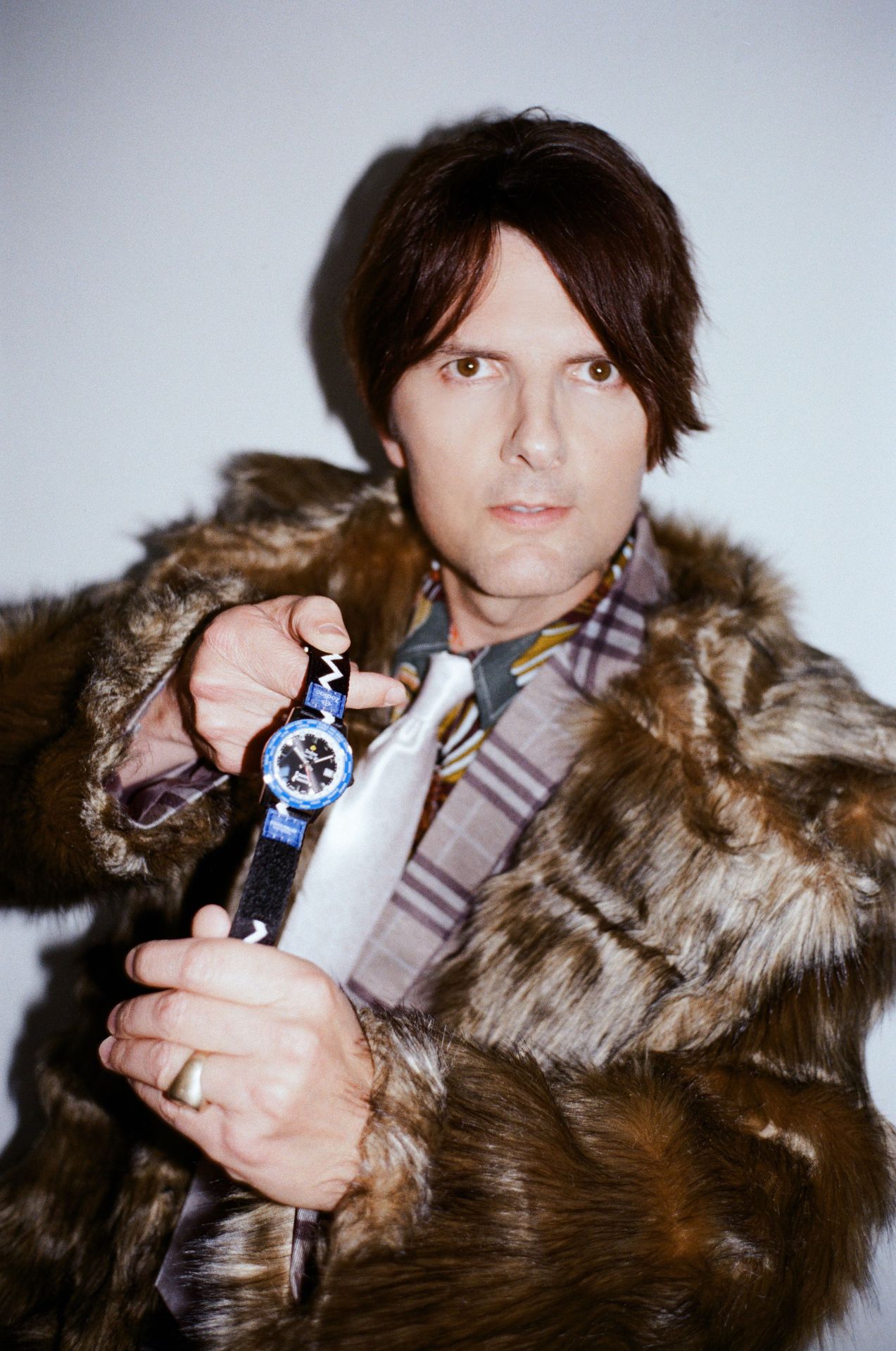 actor adam scott holds a watch