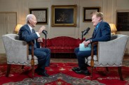 a couple of men sitting in chairs