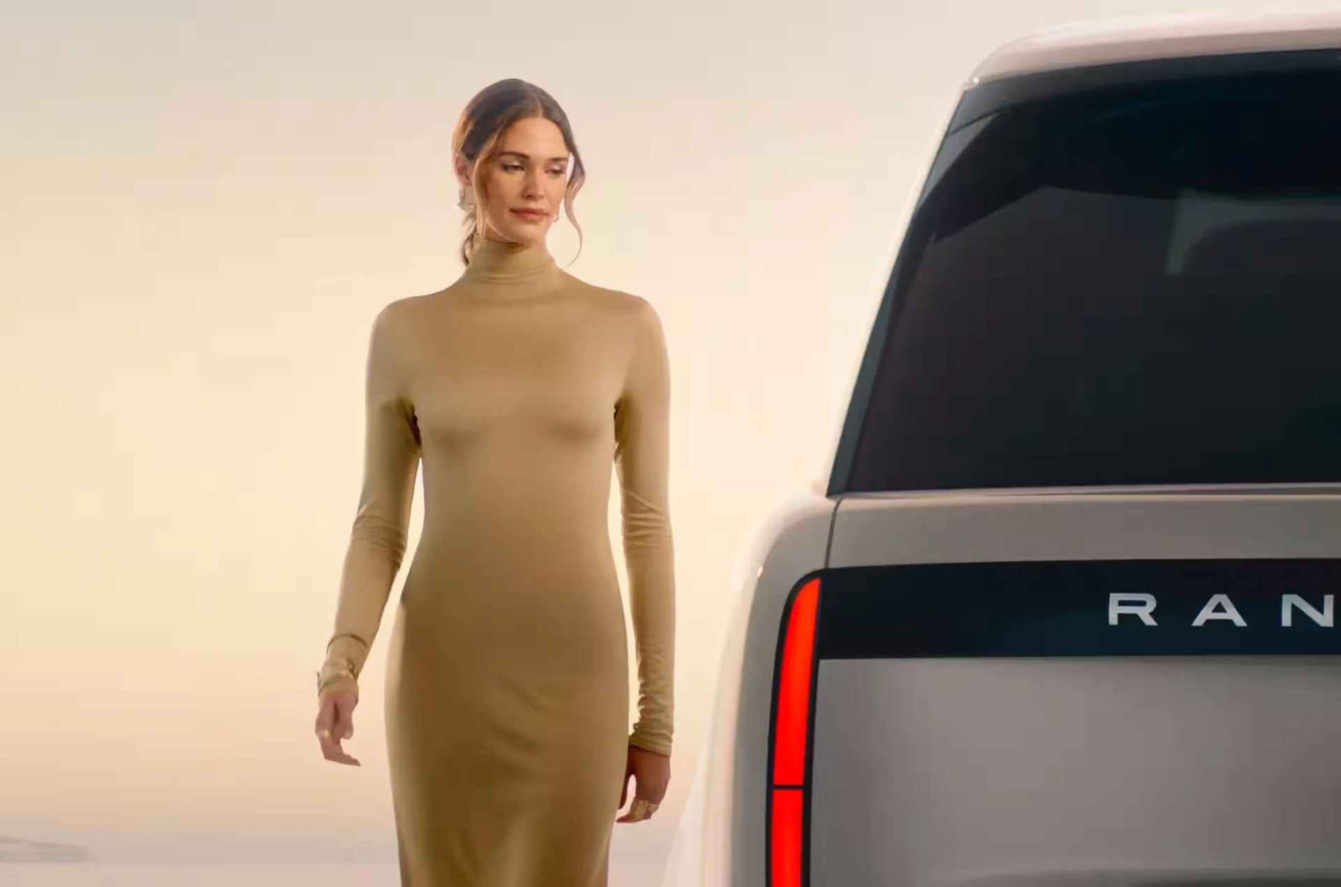 a person standing next to a car