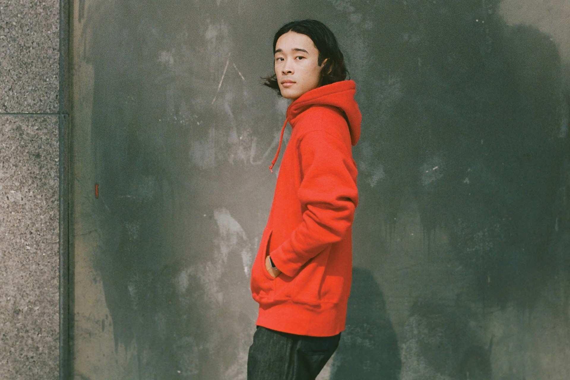 a person wearing a red hoodie
