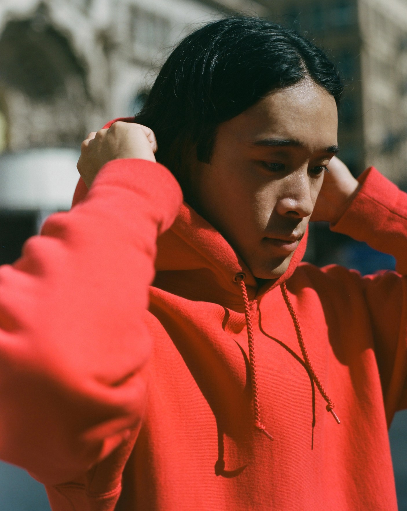 a person wearing a red hoodie