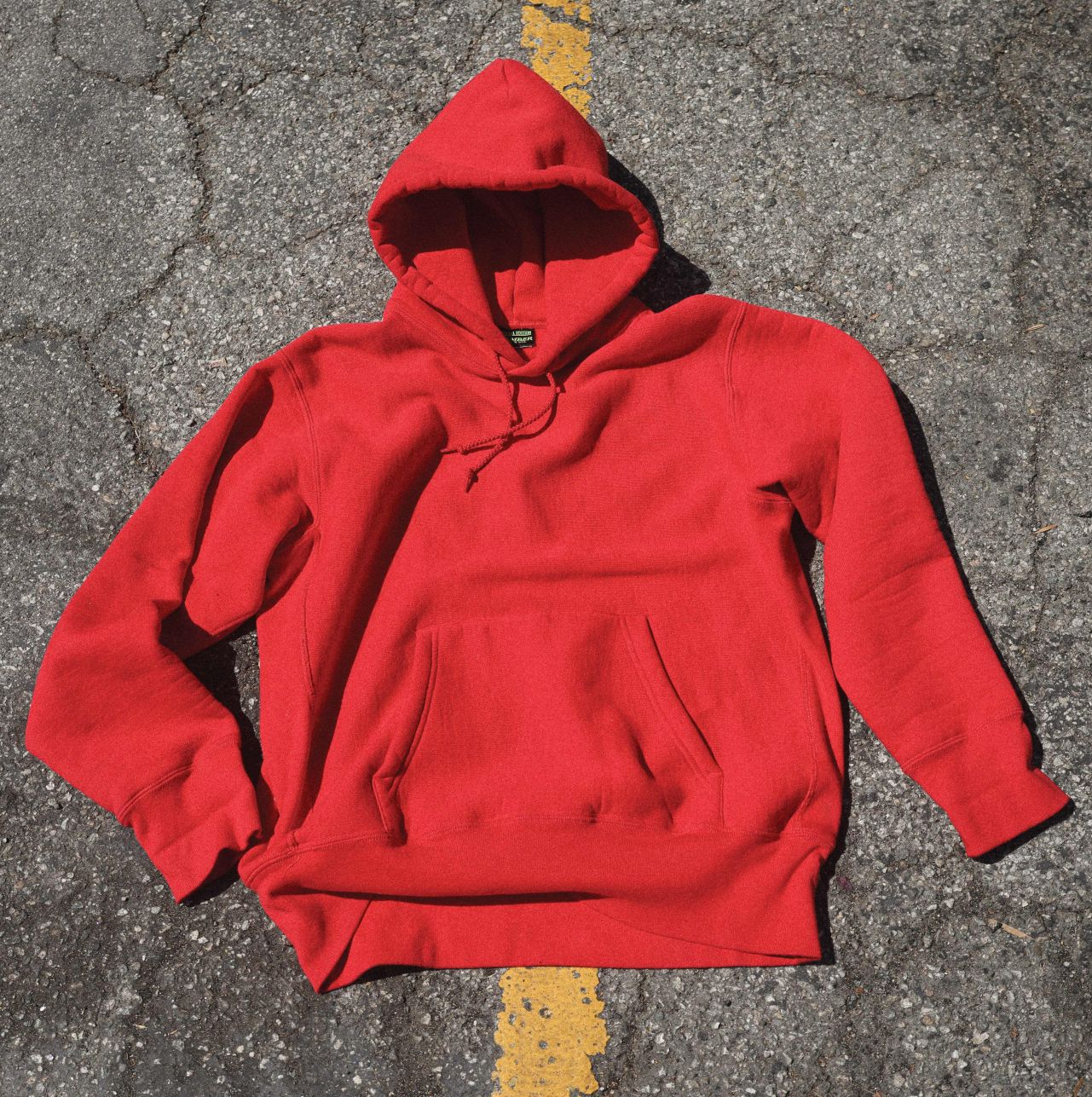 a red hoodie laying on the ground