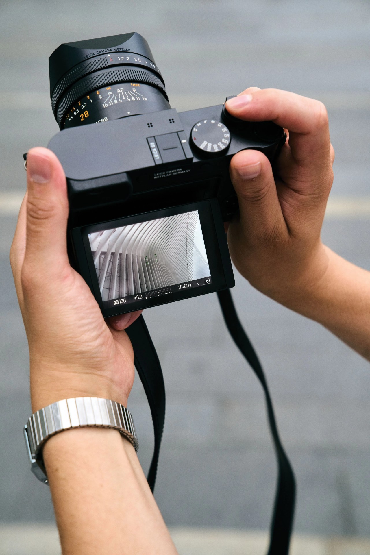 a hand holding a camera