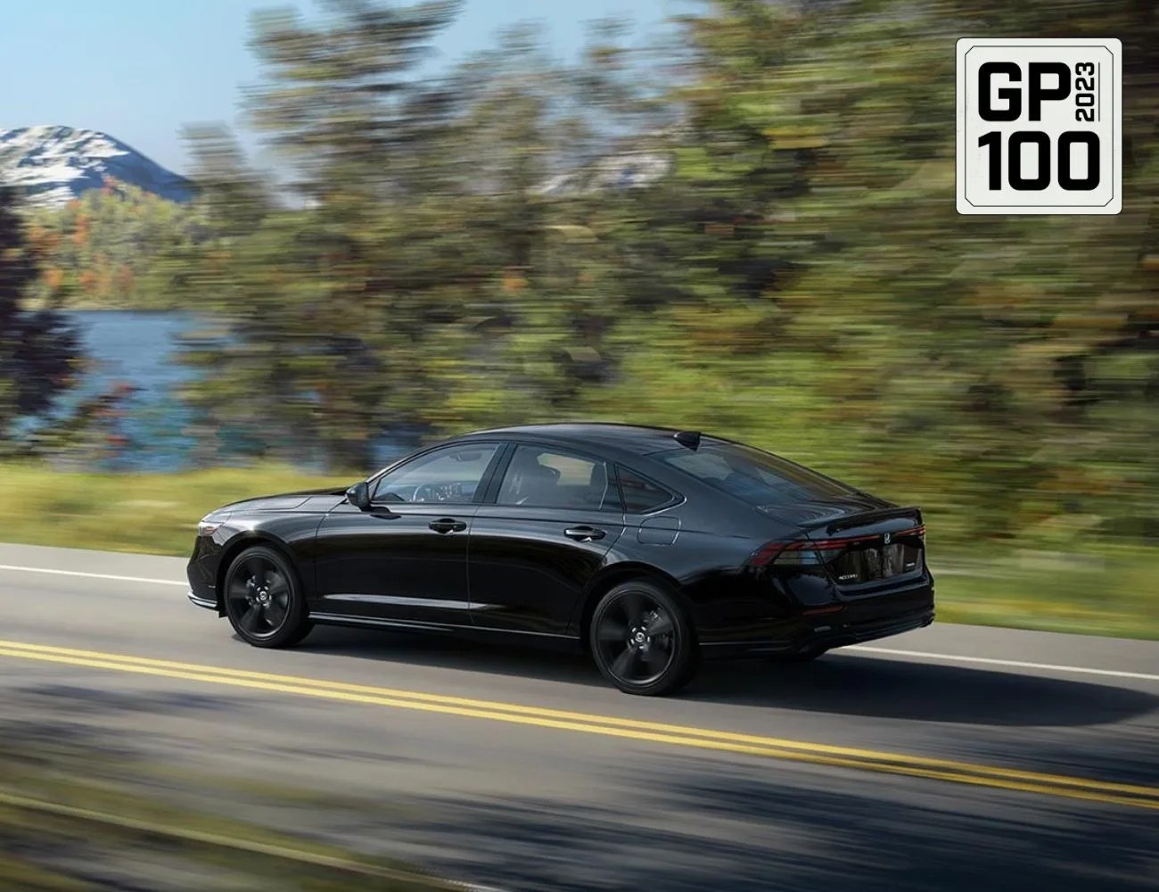 a black car driving on a road
