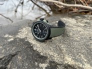 a watch on a rock near water