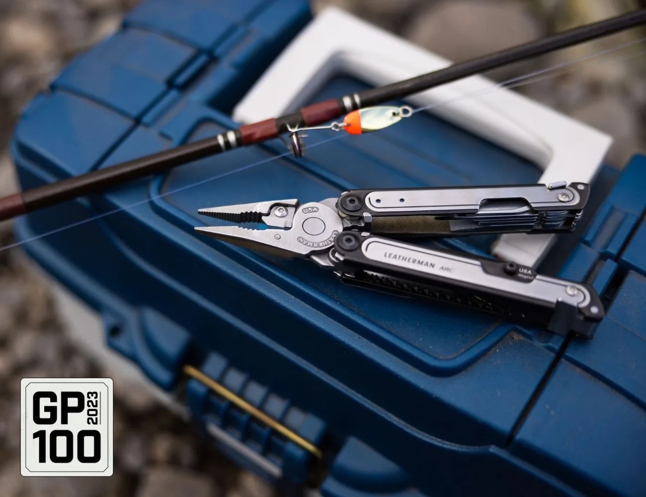a tackle box with a pair of pliers on it