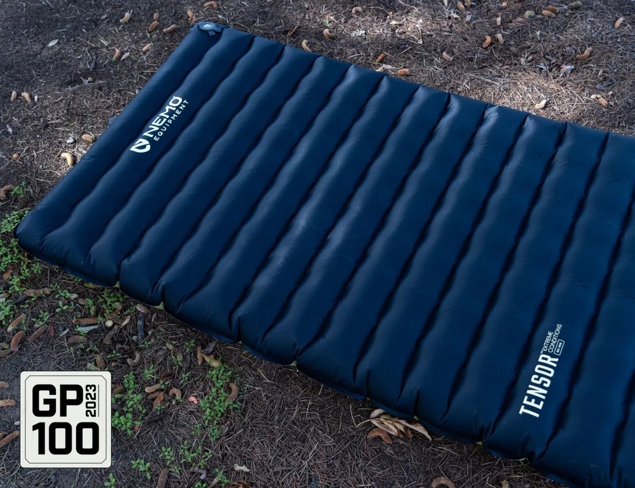 a blue air mattress on the ground