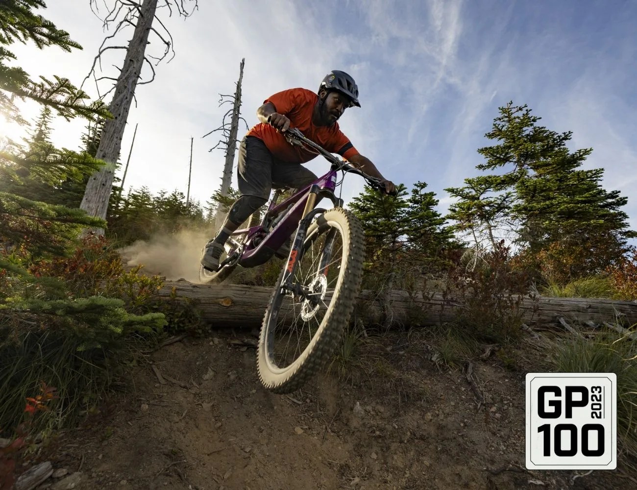 a man riding a bike on a dirt trail