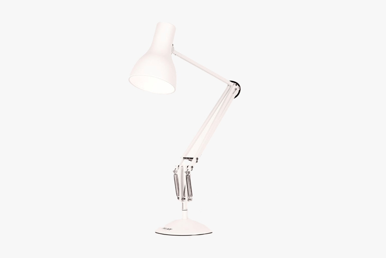 a white lamp with silver spring accents on a white background