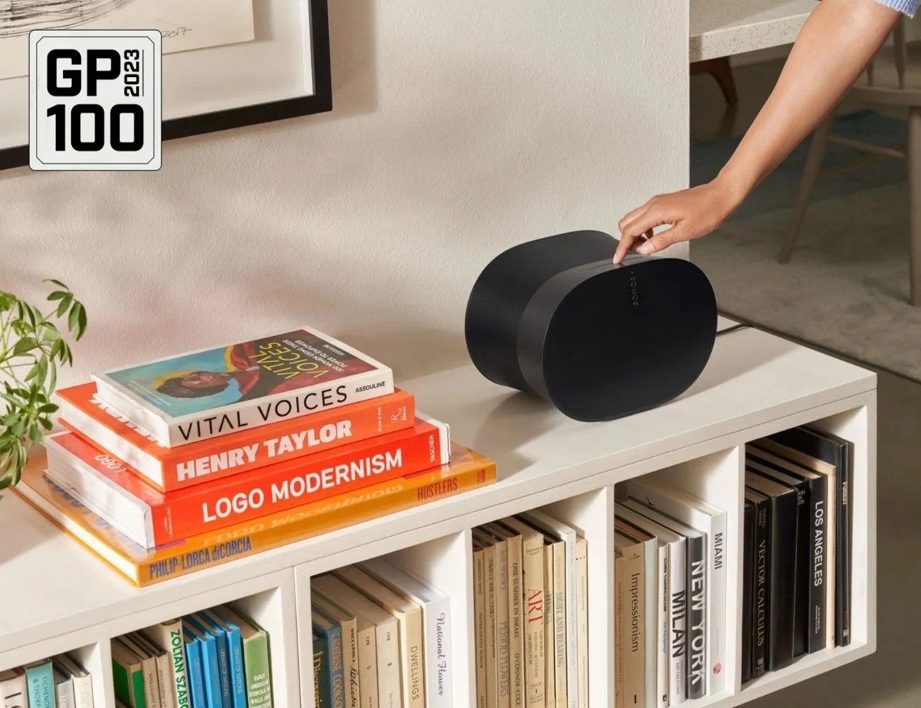 a speaker on a bookshelf