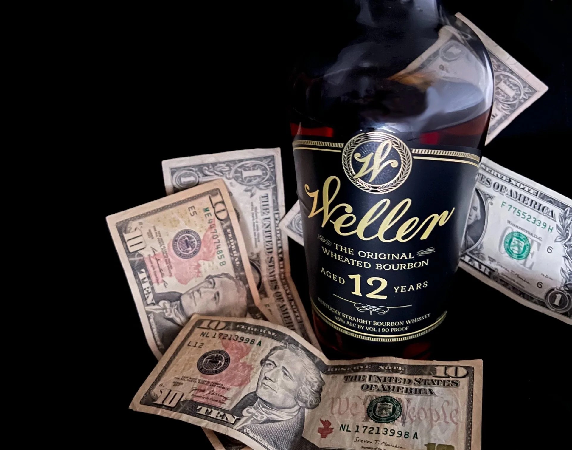 bottle of weller bourbon with money