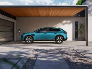 a blue car parked in front of a building