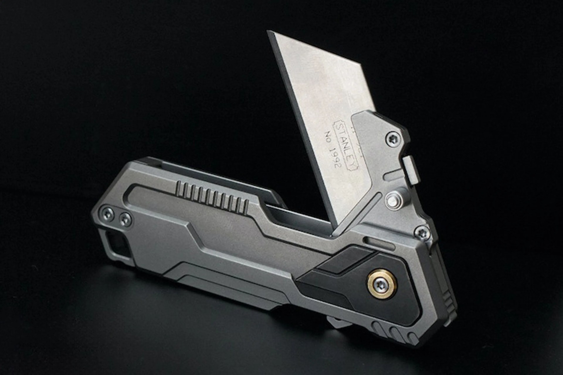 a silver and black utility knife