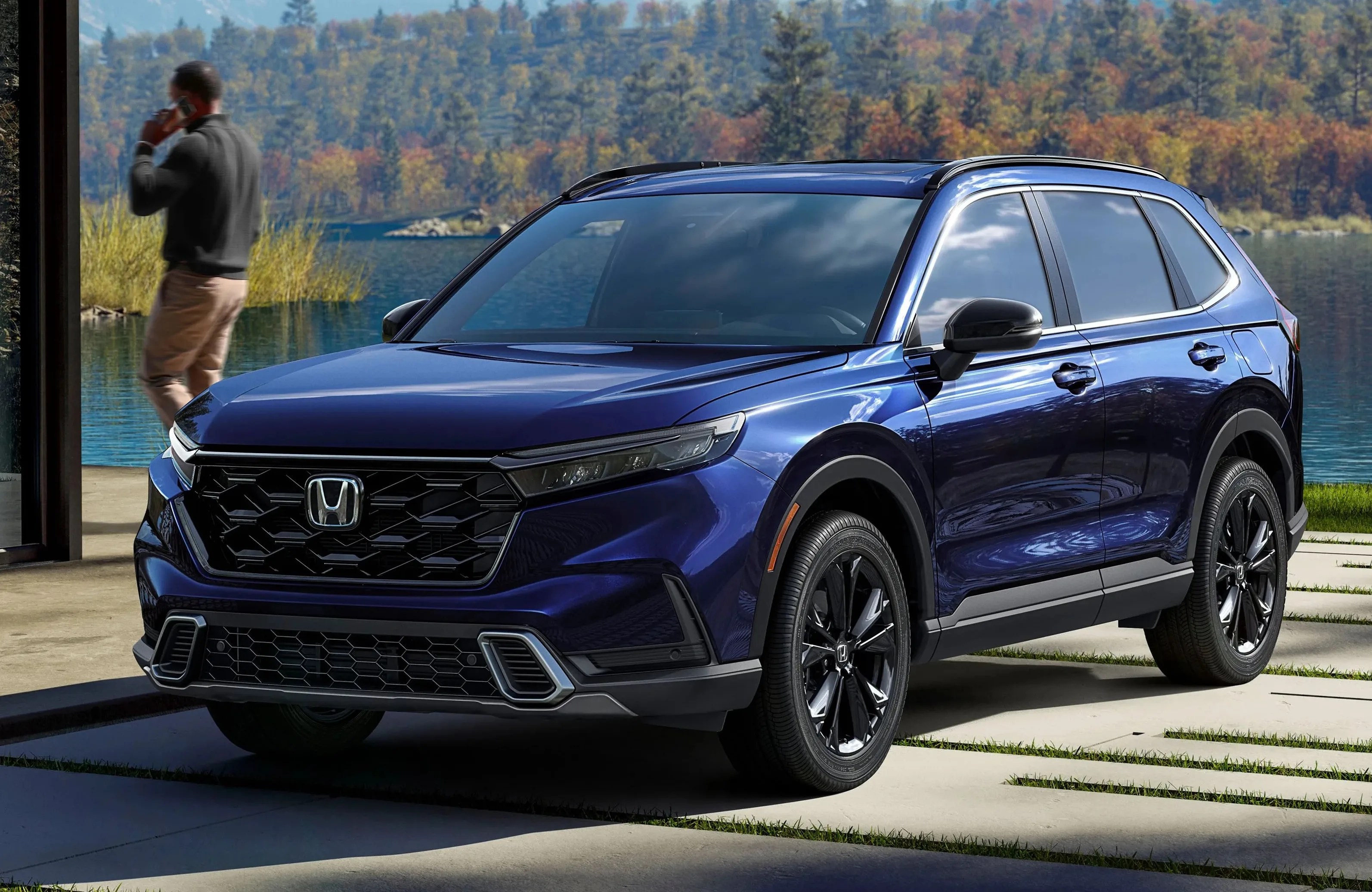 honda suv parked by a lake