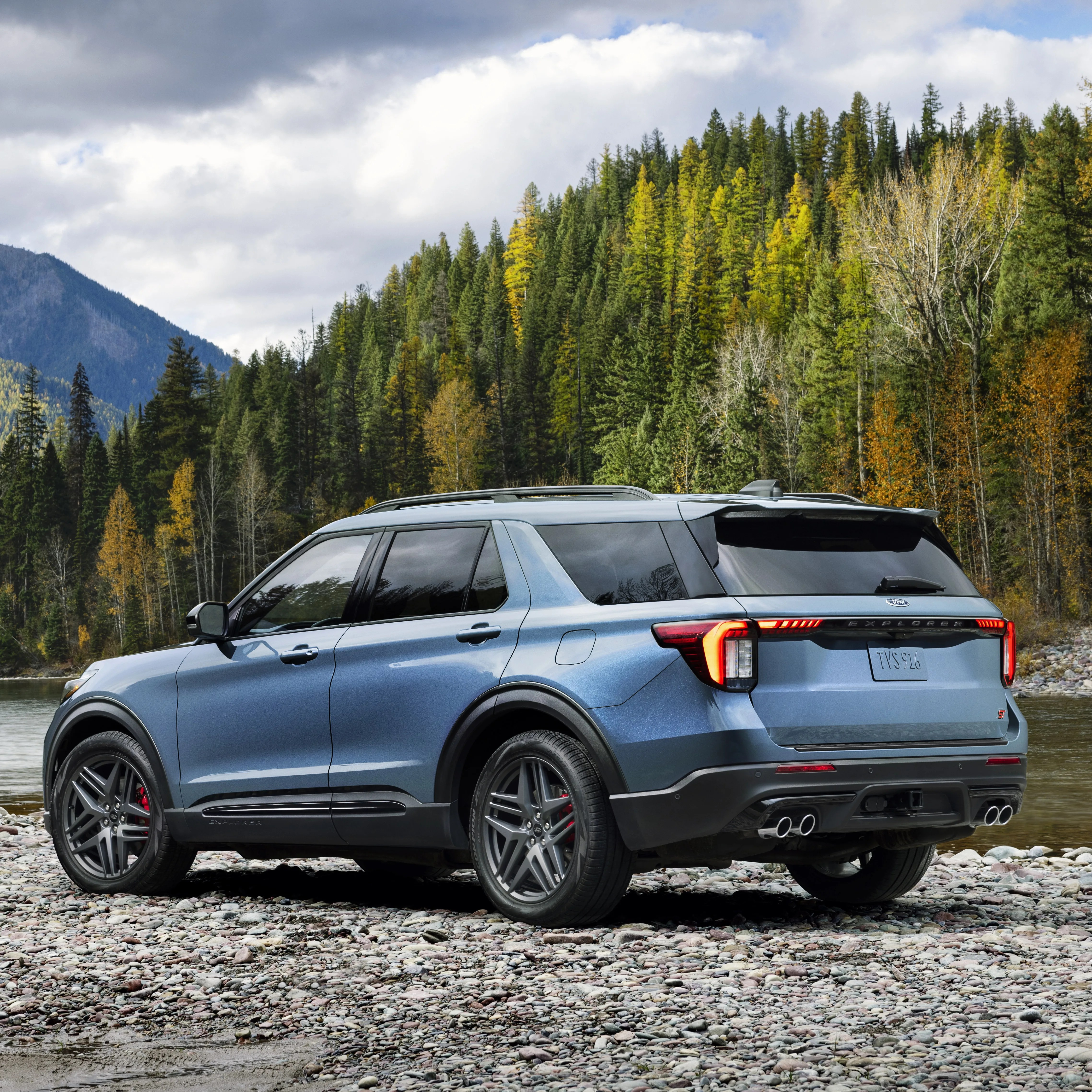 ford explorer parked by a river