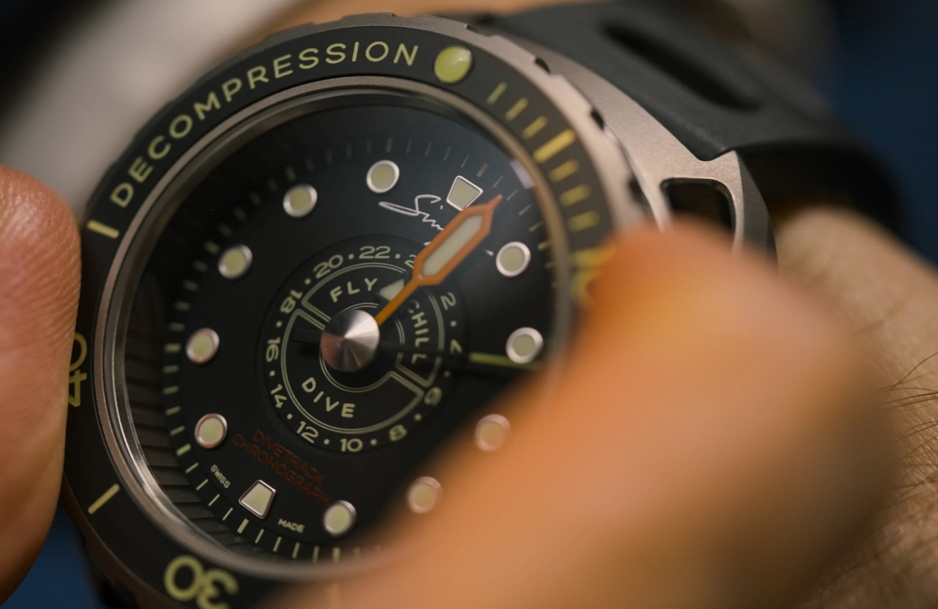 singer dive watch being adjusted on wrist