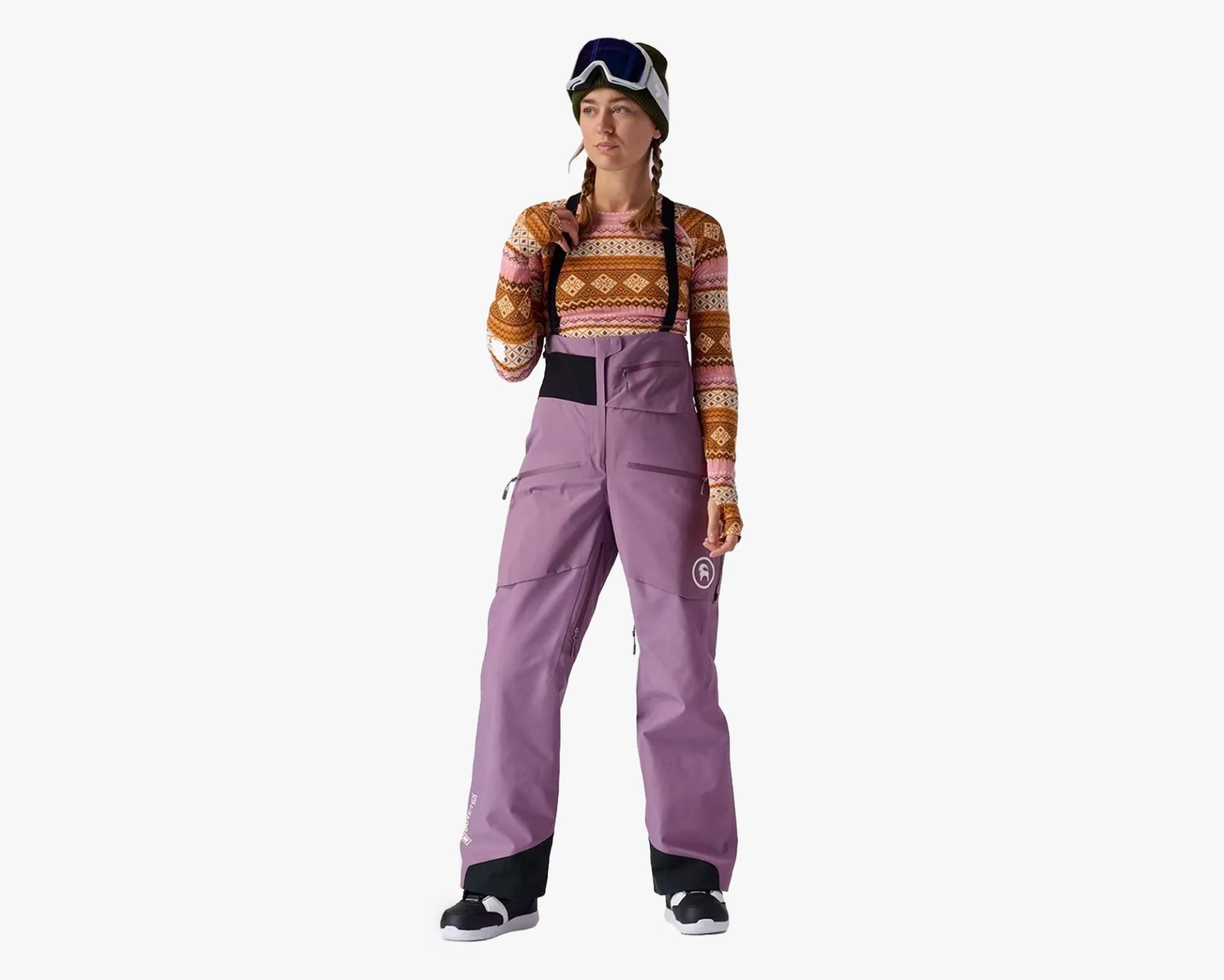 A snowboarder models pink gortex snow bibs