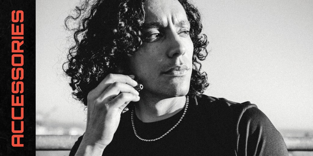black and white image of a man using ear buds with a headline that says accessories