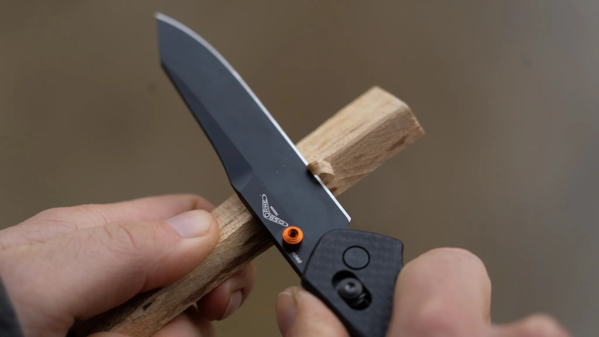 knife being used to cut wood