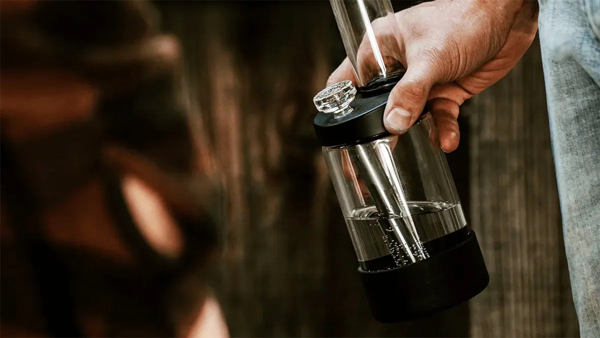 man holding a bong