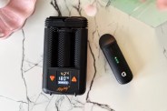 two weed vapes on a counter next to each other