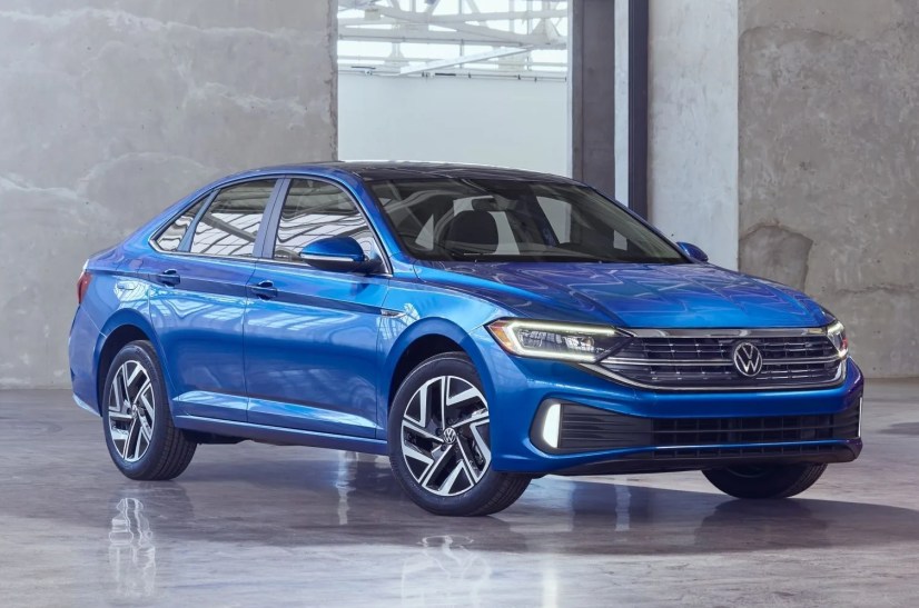 2024 volkswagen jetta in blue and jetta gli in red in an art gallery