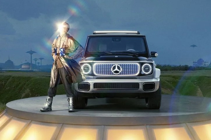 mercedes benz eqg concept on a stand with a golden god