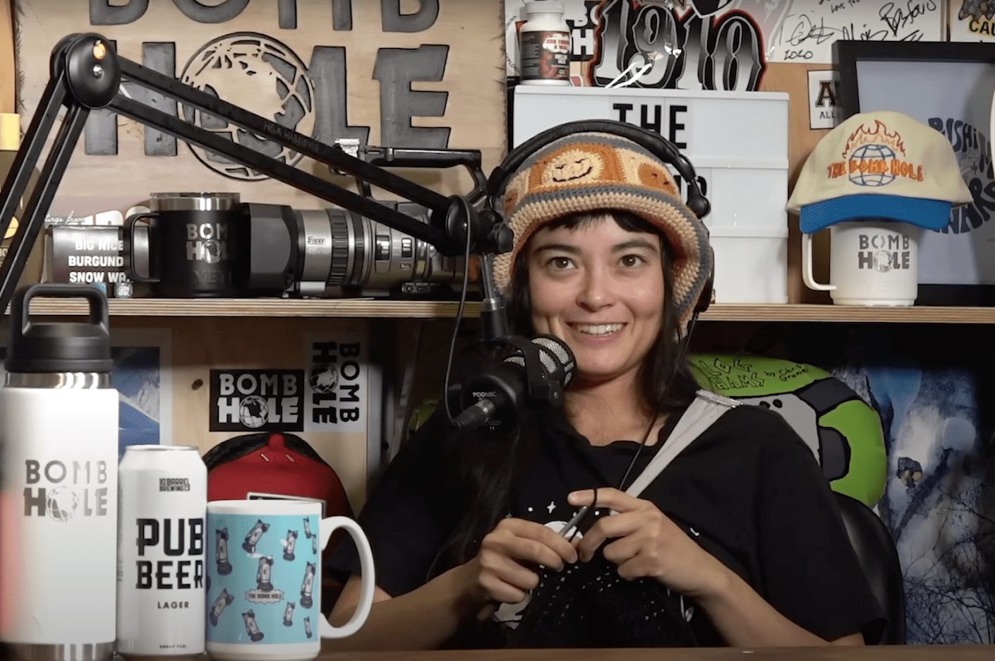 a person wearing a hat and headphones