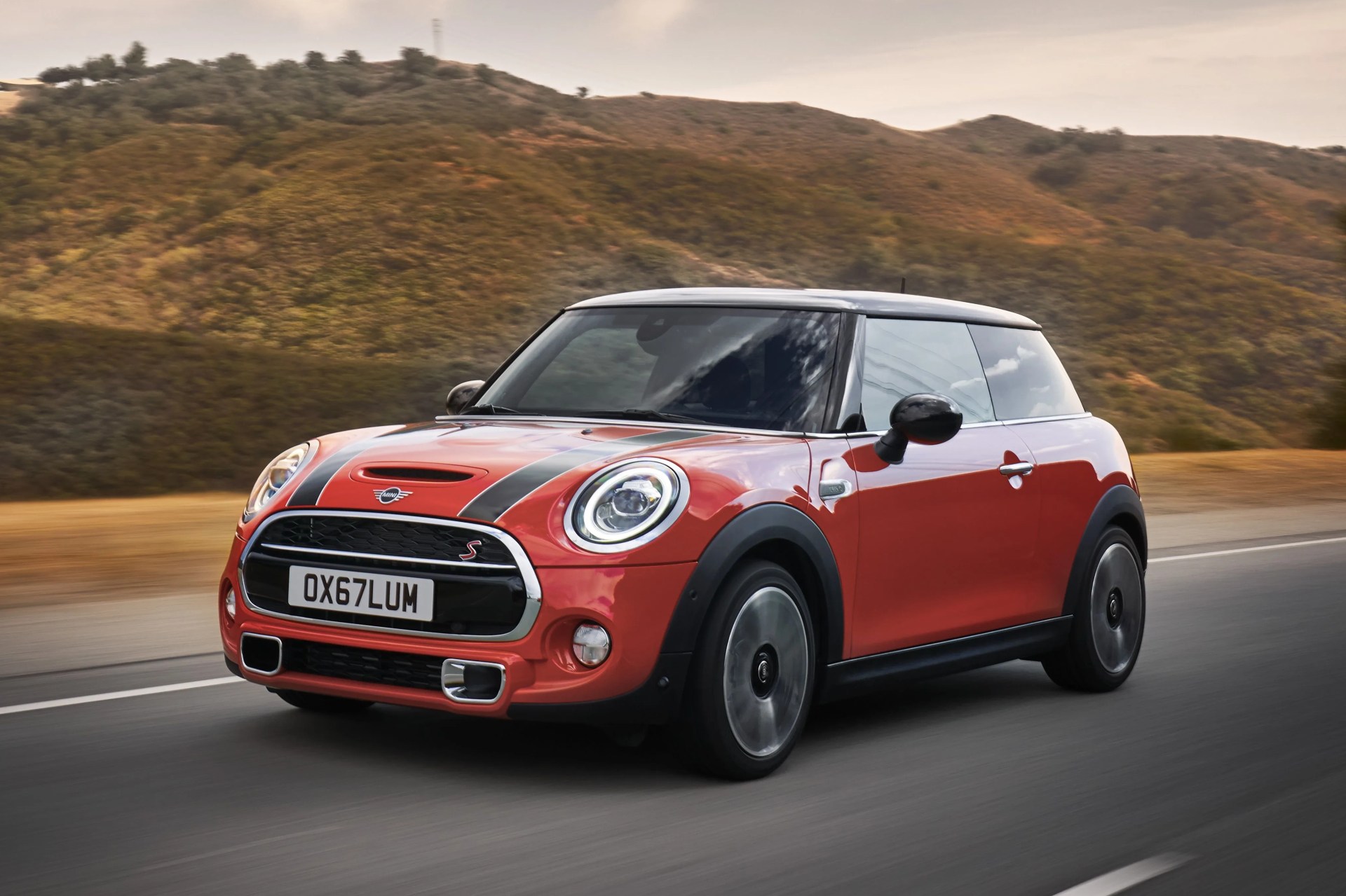 2021 mini cooper hardtop in orange on a road