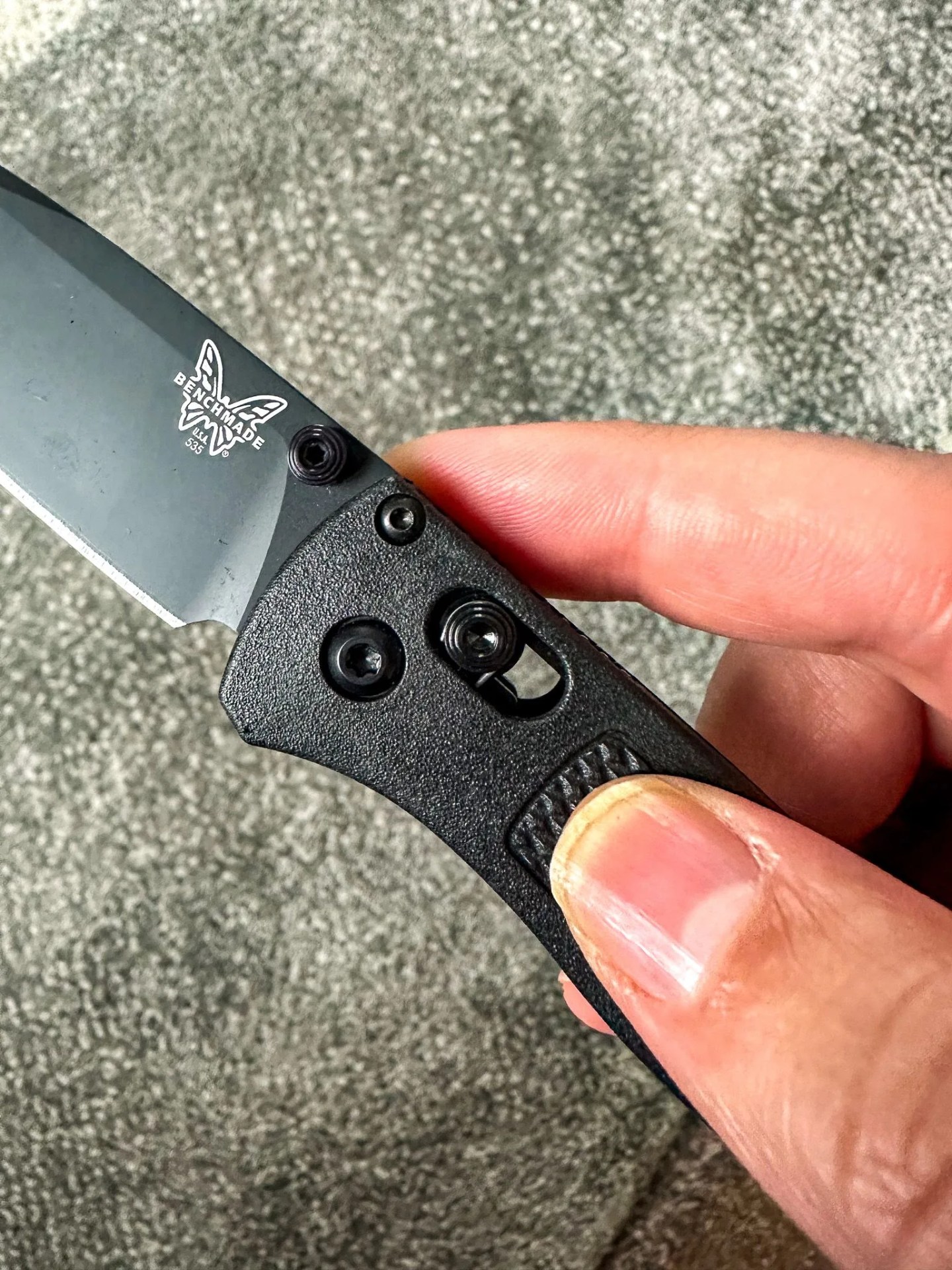 a hand holding a knife