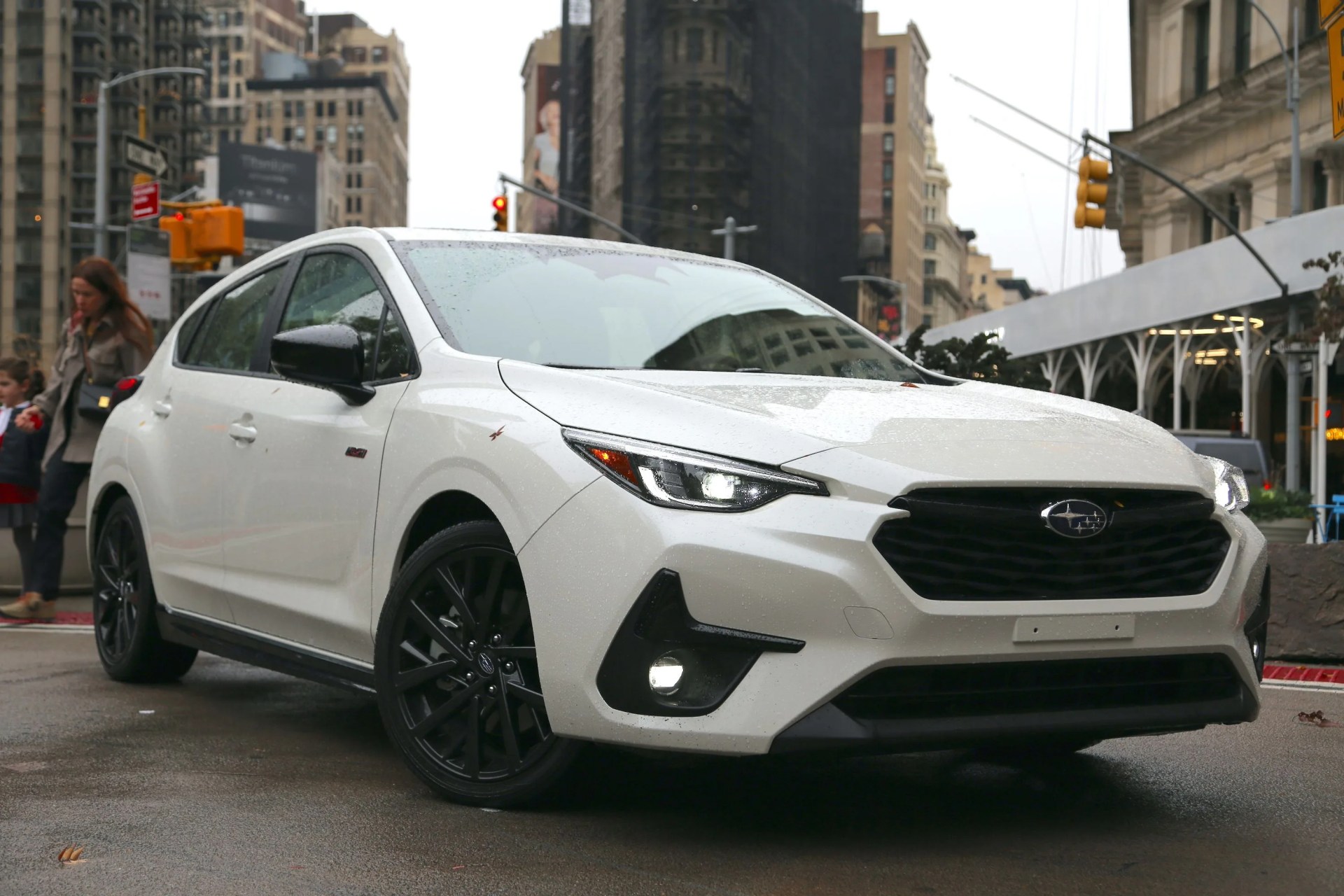 2024 subaru impreza rs in white parked on a street