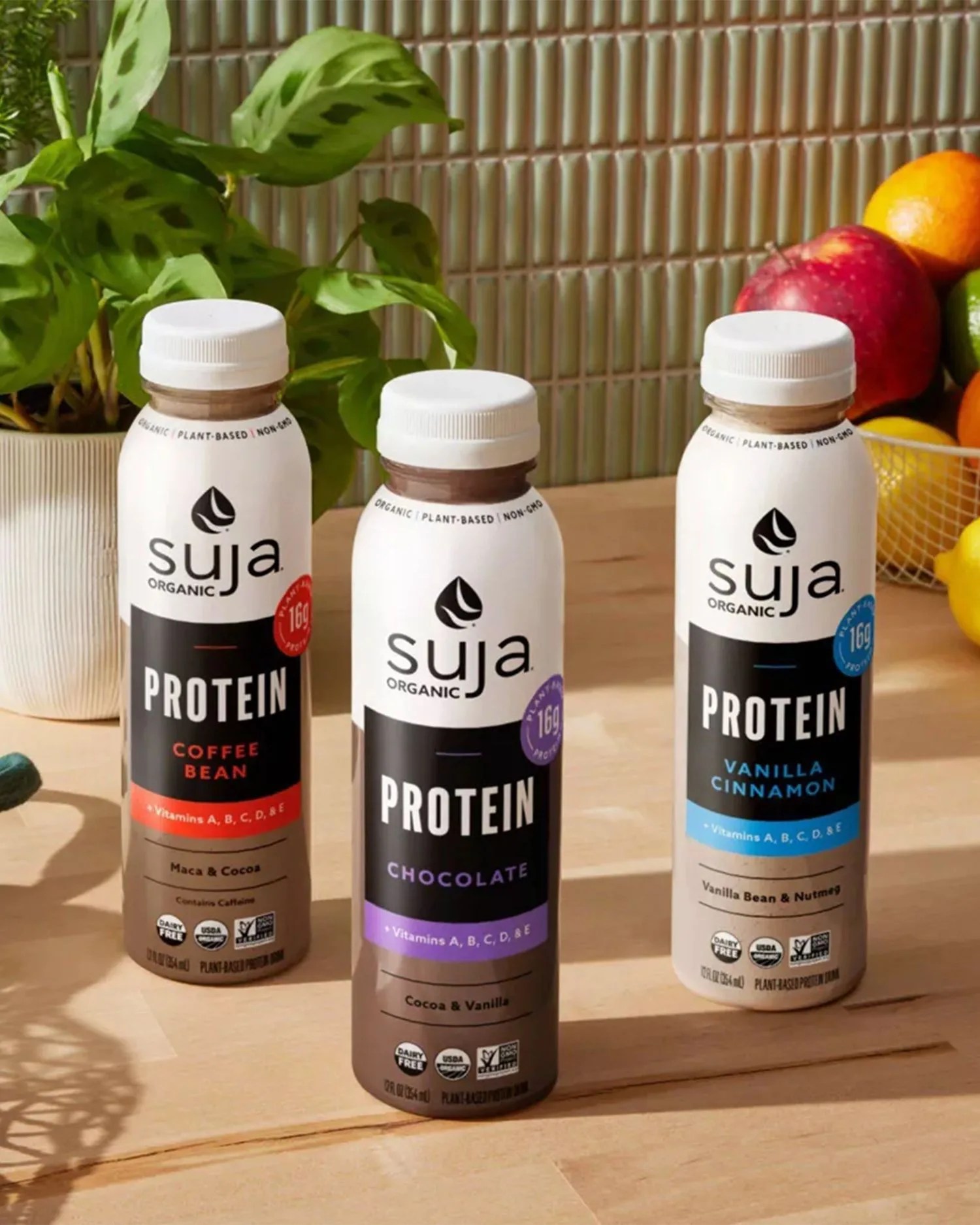 a group of bottles of protein shakes on a counter