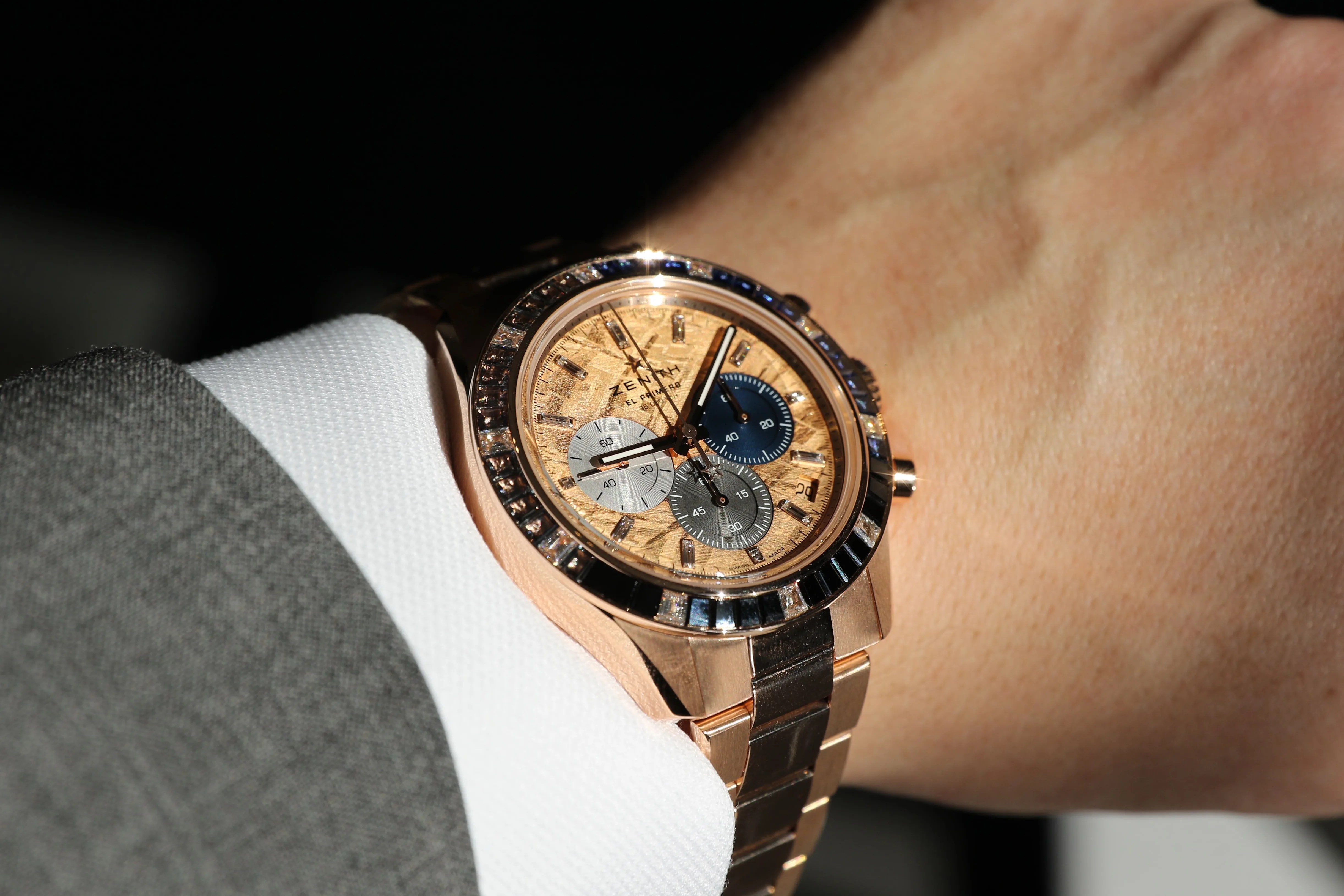 gold watch on wrist