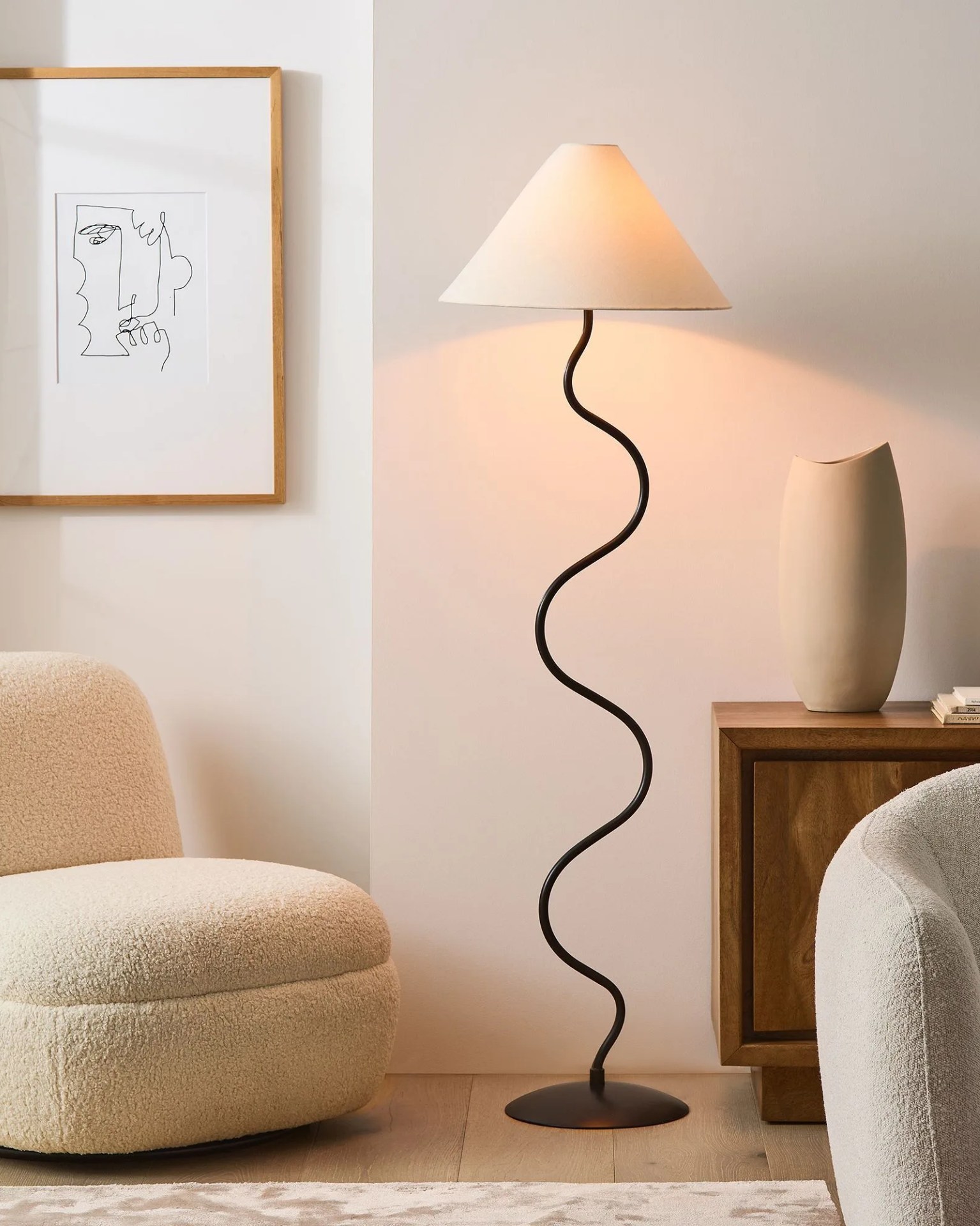 a west elm zigzag floor lamp next to a chair