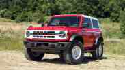 Ford Bronco parked in a field