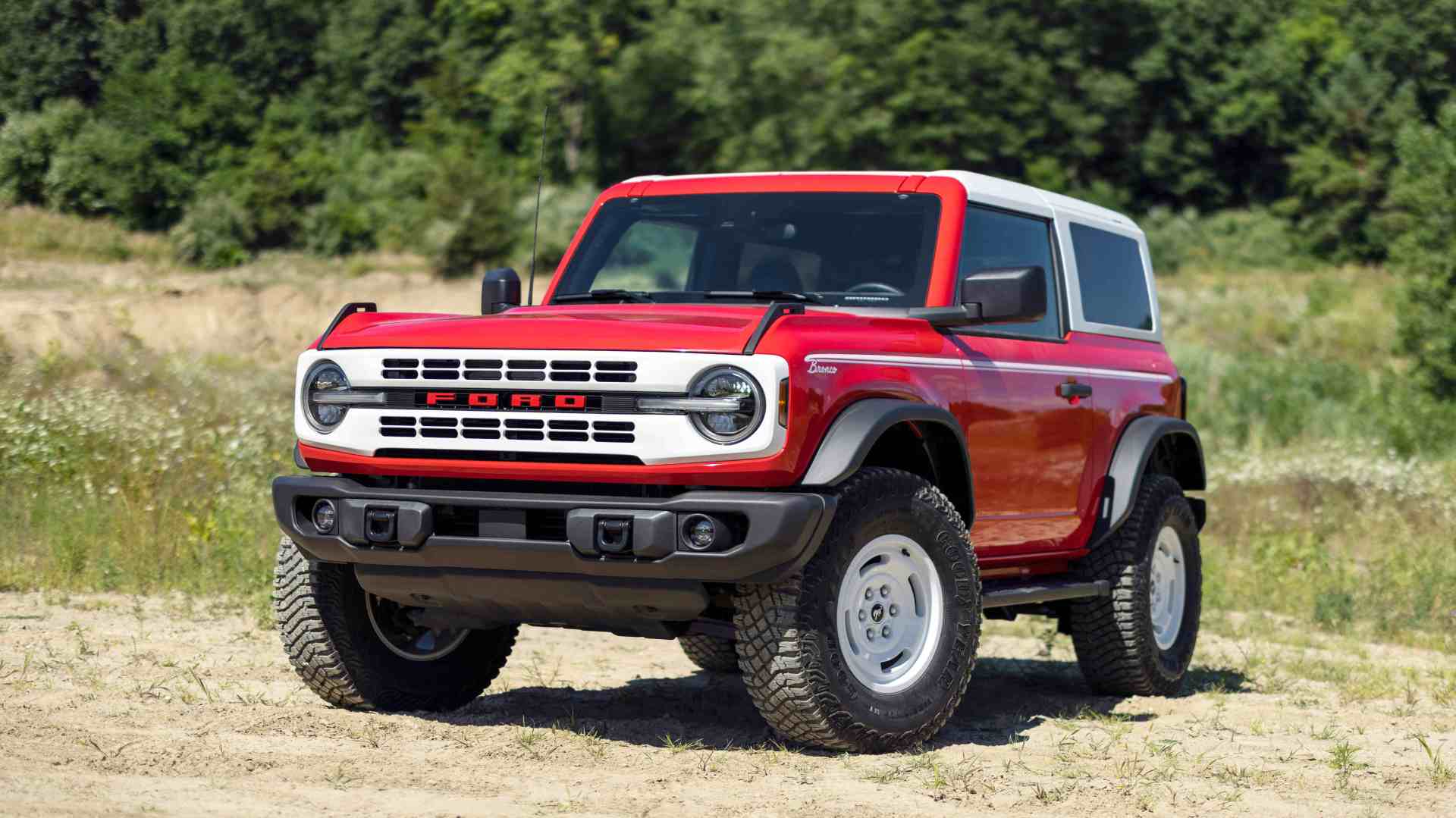 Ford Bronco parked in a field