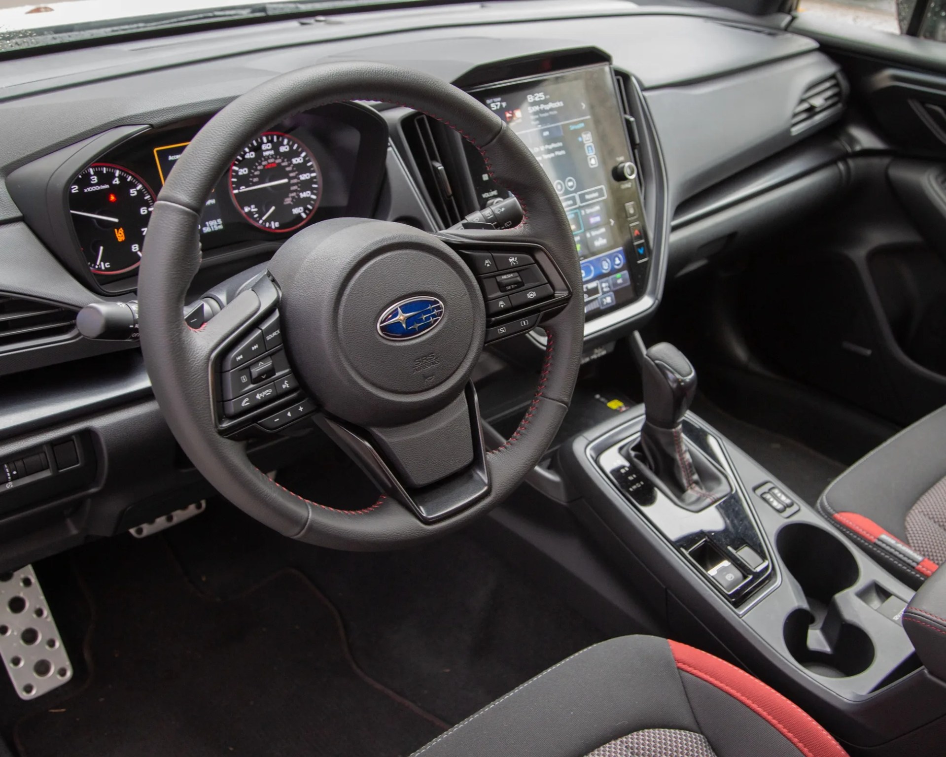 the steering wheel and dashboard of a 2024 subaru impreza rs