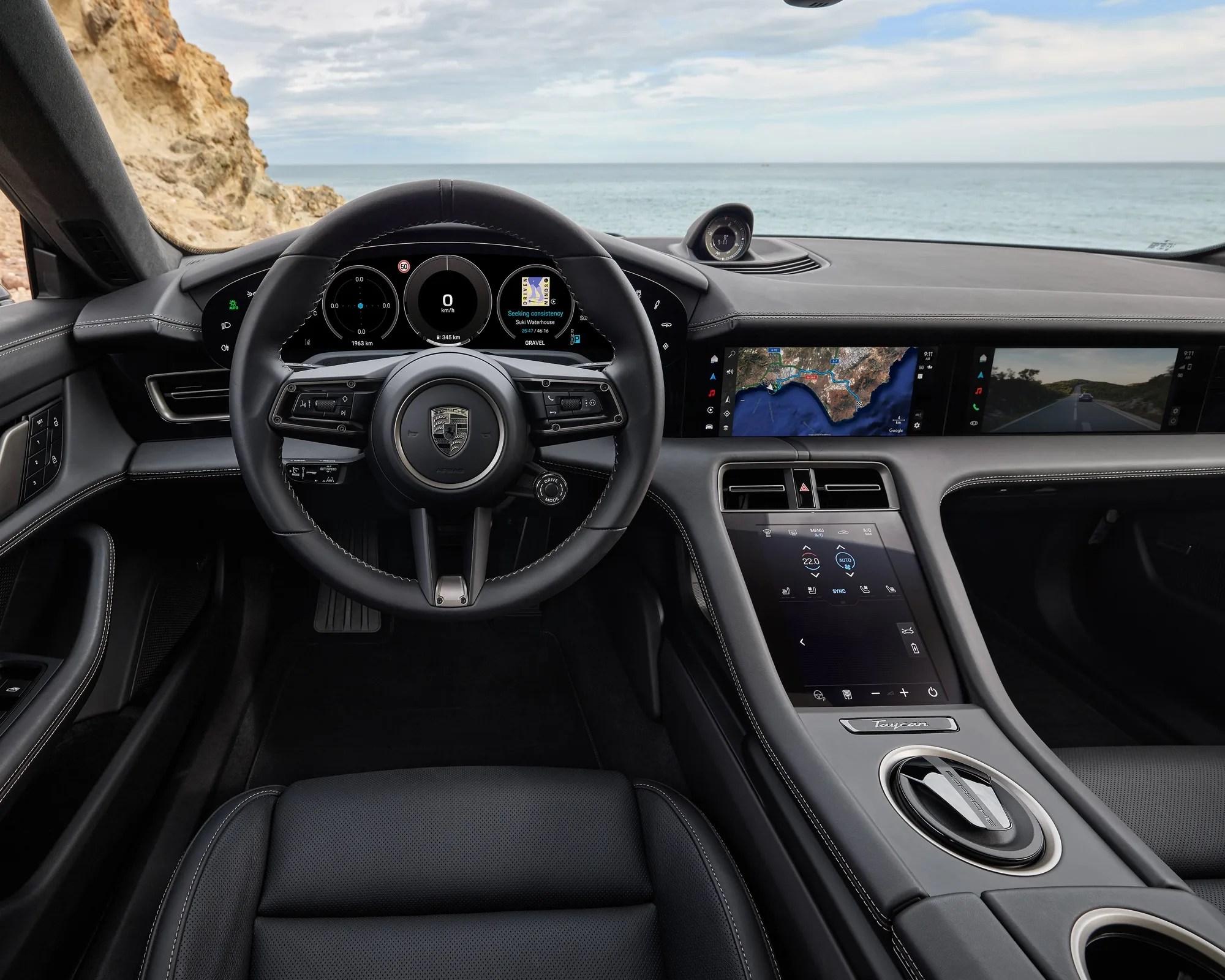 dashboard off the 2025 porsche taycan as seen next to the ocean