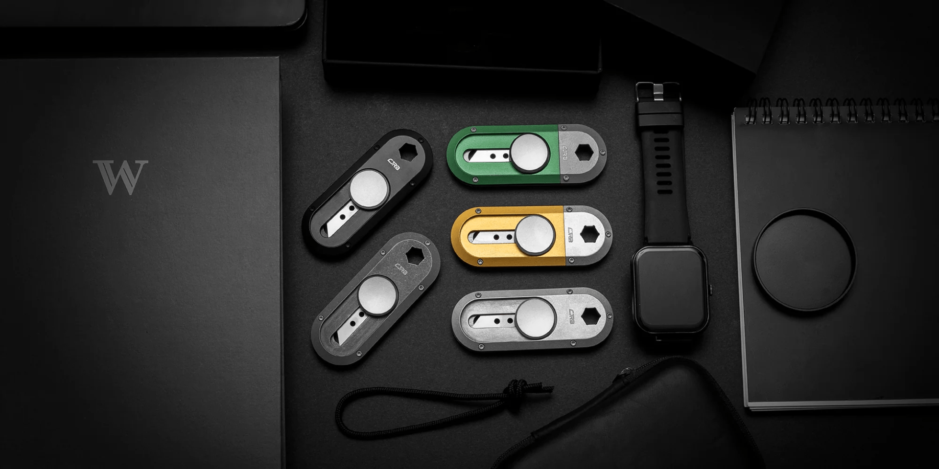 small utility knives on a black background