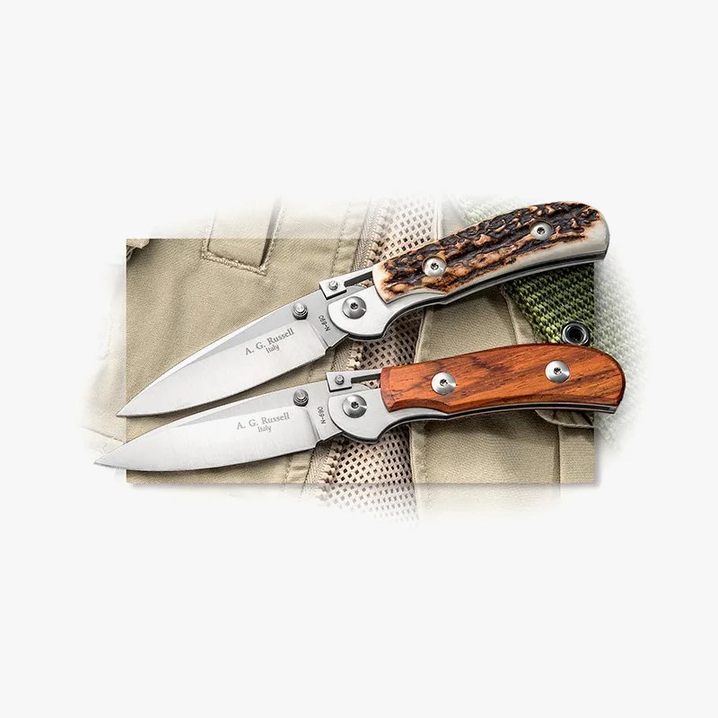 two knives on a fishing jacket