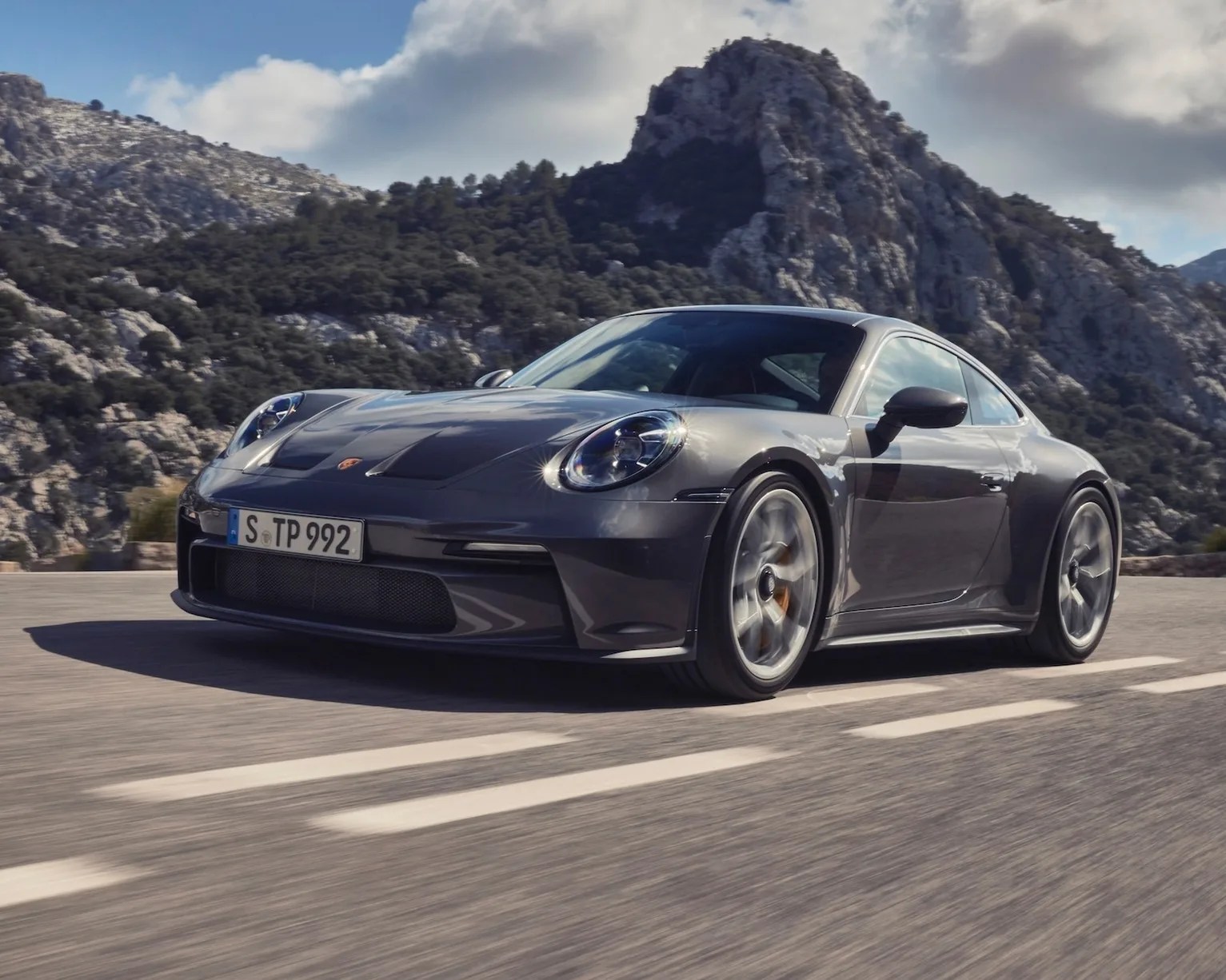 Porsche 911 driving on road