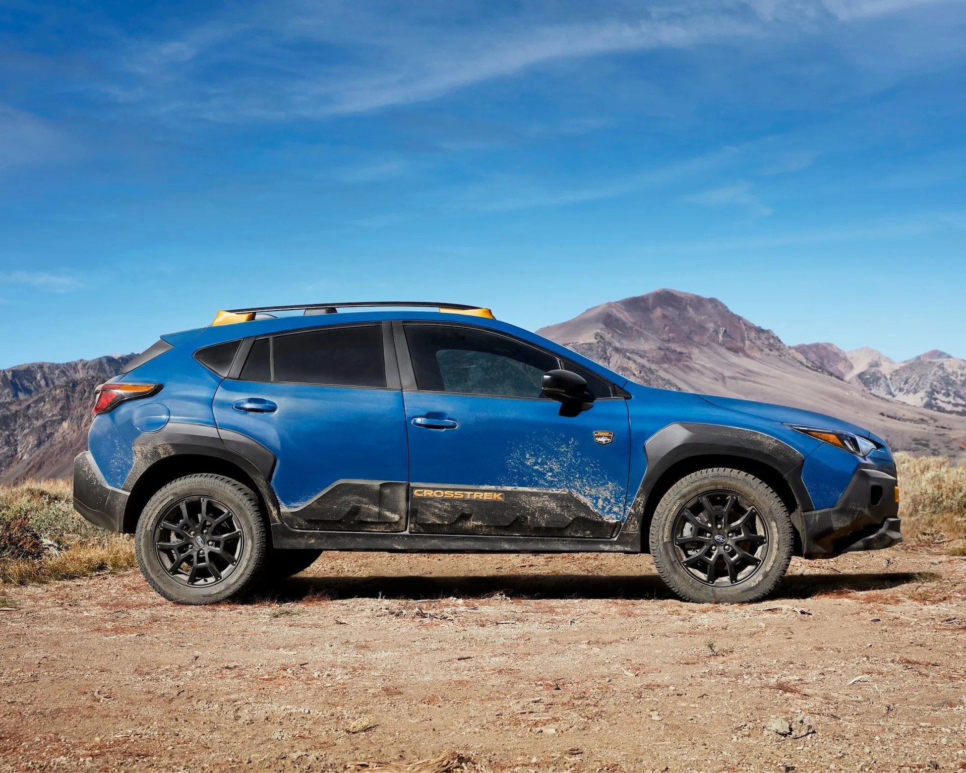 Subaru Crosstrek Wilderness parked on dirt in mountains