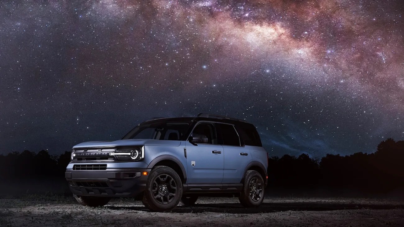 blue ford bronco sport suv under a starry sky