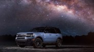 blue ford bronco sport suv under a starry sky
